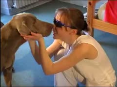 Naughty young girl plays with her cute doggy